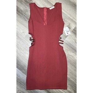 Bodycon mini‎ dress with cutout metal sides size small